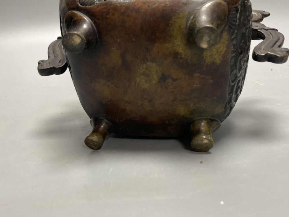A Chinese bronze censor and a Buddhist figural stoop, stoop, 23cm high